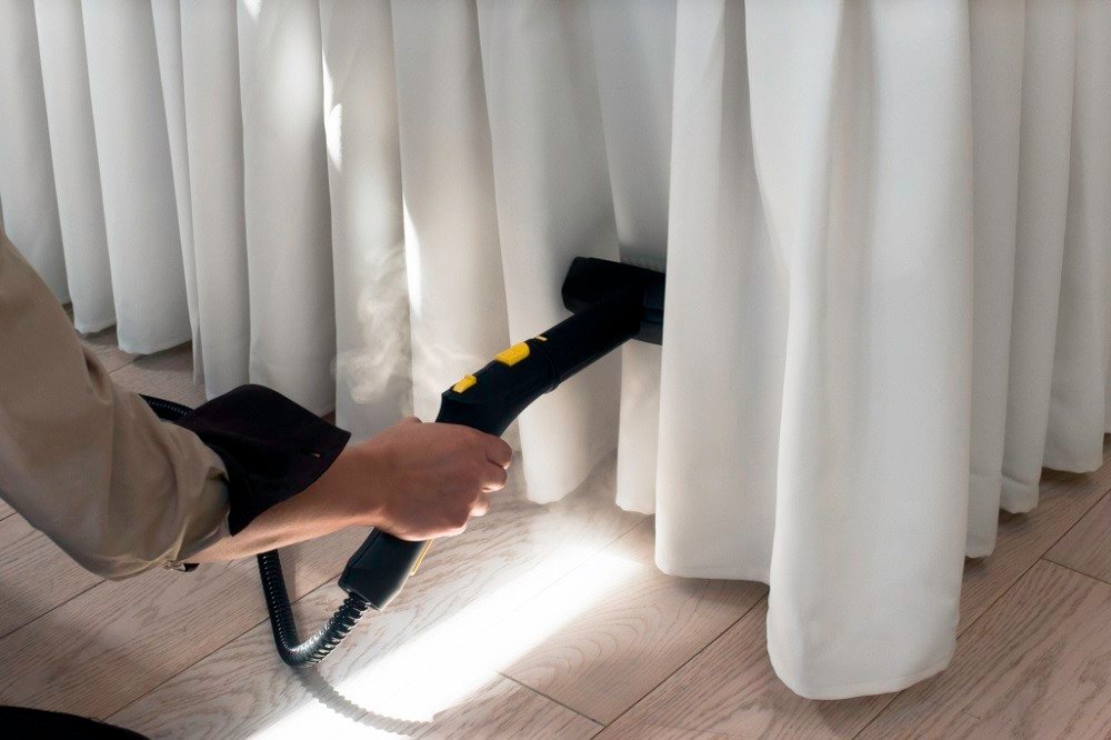 ironing with garment steamer